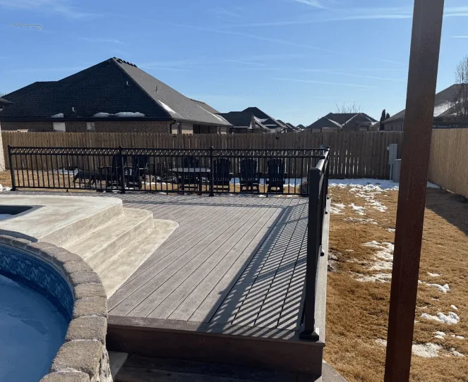 TimberTech composite deck with black aluminum railing — JHG Contracting LLC serving Lowell, AR